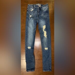 Ripped Mid-Rise Skinny Jeans in Medium Wash